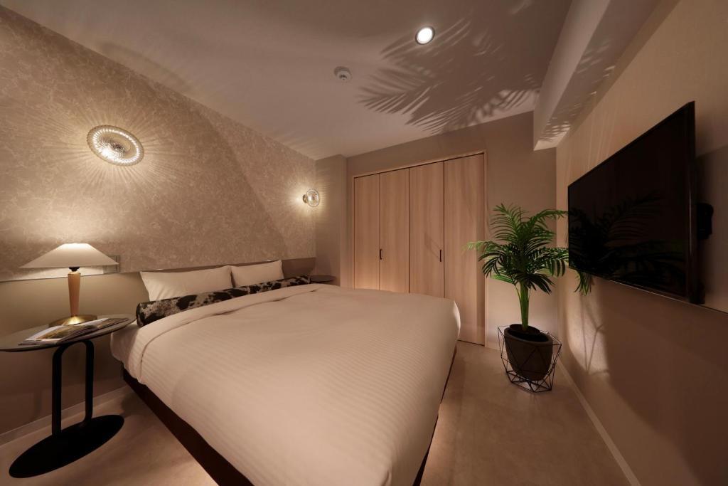 TV a/nebo společenská místnost v ubytování Dotombori Crystal Hotel 3