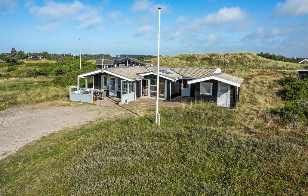 an aerial view of a house on the beach at Holiday Home Holmsborgvej Ringkøbing X in Søndervig