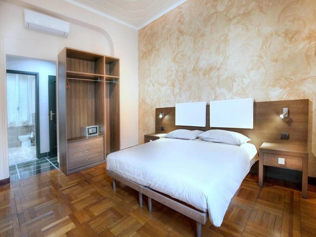 Postel nebo postele na pokoji v ubytování Guesthouse Vittoria Rooms - the Original since 2015