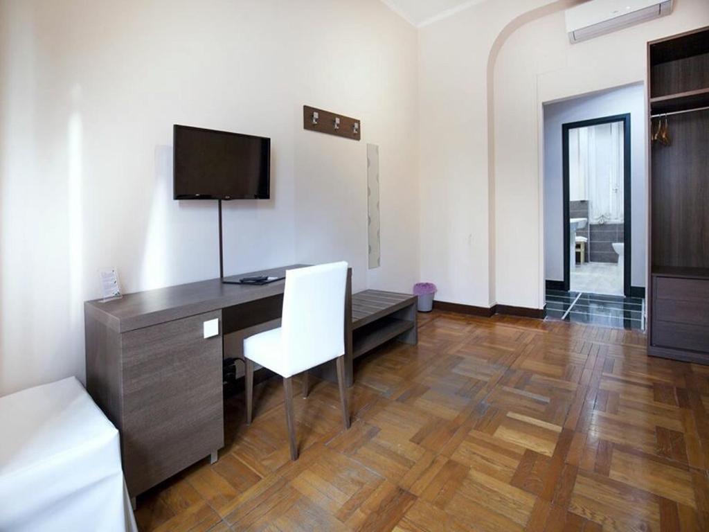 TV a/nebo společenská místnost v ubytování Guesthouse Vittoria Rooms - the Original since 2015