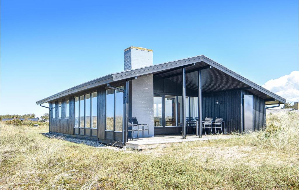 a small house on a hill with glass at Tina in Klegod