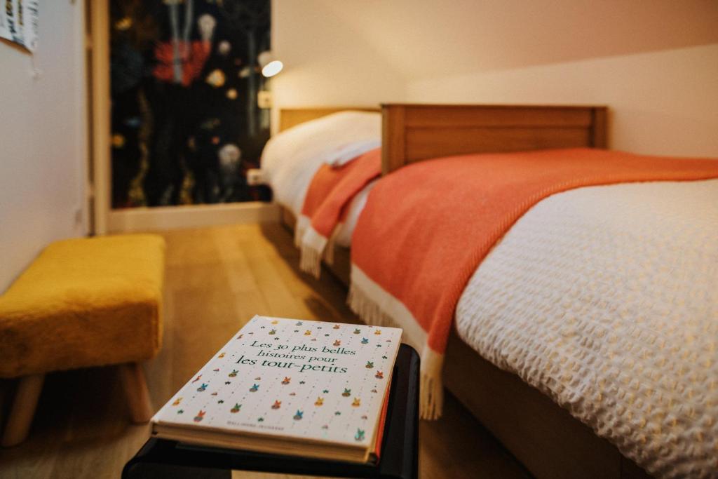 Postel nebo postele na pokoji v ubytování Le Mora Hôtes