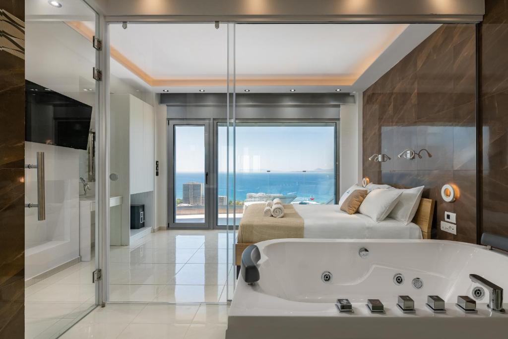Posteľ alebo postele v izbe v ubytovaní Rhodes SkyLine Suites
