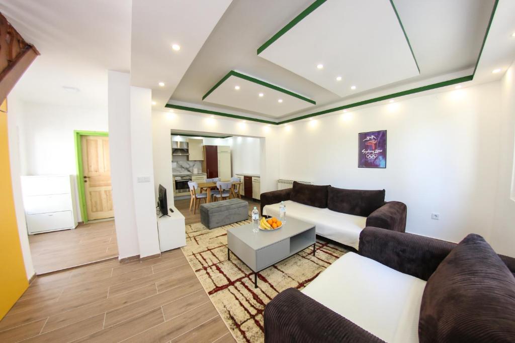 a living room with a couch and a table at Apartments Villa Begić in Sarajevo