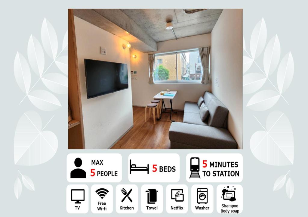 a living room with a couch and a television at PRISM Inn Komagata Asakusa in Tokyo