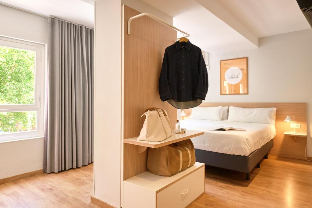 Postel nebo postele na pokoji v ubytování Rooms Ciencias