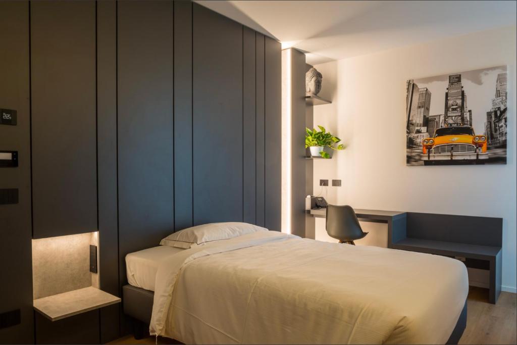 Postel nebo postele na pokoji v ubytování Hotel Acquamatta