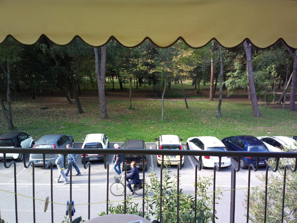 a group of cars parked in a parking lot at Hotel Delhy in Viareggio