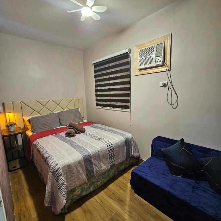 Postel nebo postele na pokoji v ubytování Davao City Airport Transient Rooms by Lemonique