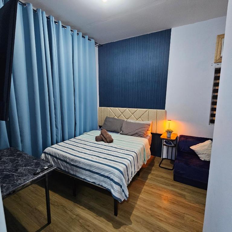Postel nebo postele na pokoji v ubytování Davao City Airport Transient Rooms by Lemonique