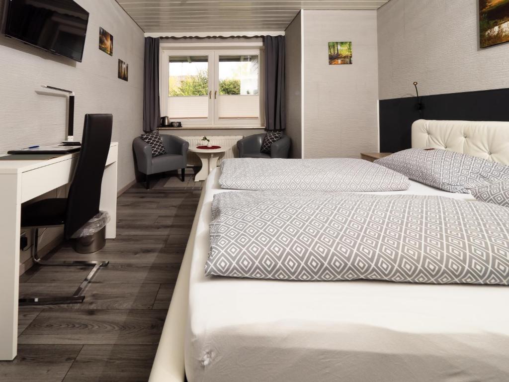 Postel nebo postele na pokoji v ubytování Hotel Brunnenbach