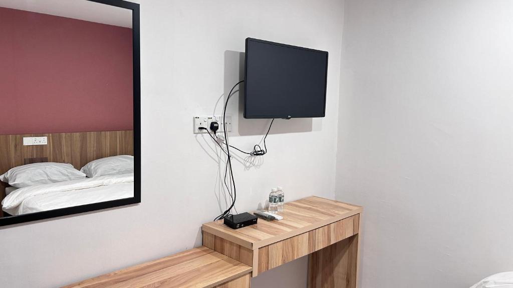 TV a/nebo společenská místnost v ubytování New YX oasis hotel 新悦喜雅居自助酒店