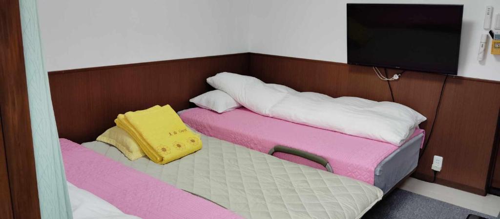 Postel nebo postele na pokoji v ubytování Oyama Guesthouse Kyoto