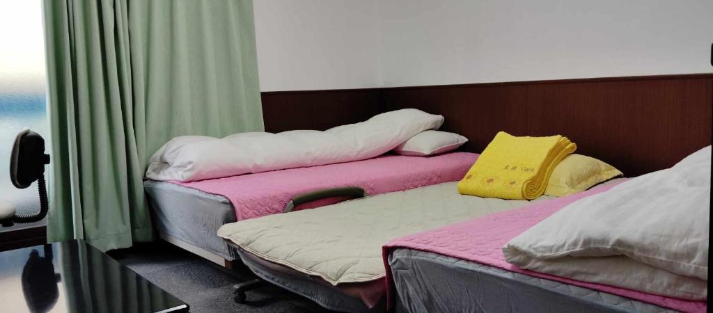 Postel nebo postele na pokoji v ubytování Oyama Guesthouse Kyoto