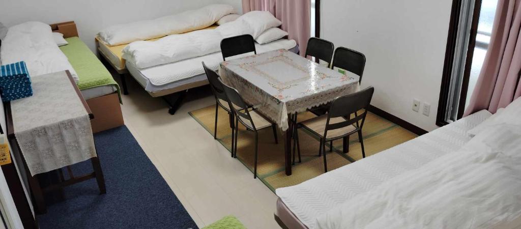 Postel nebo postele na pokoji v ubytování Oyama Guesthouse Kyoto