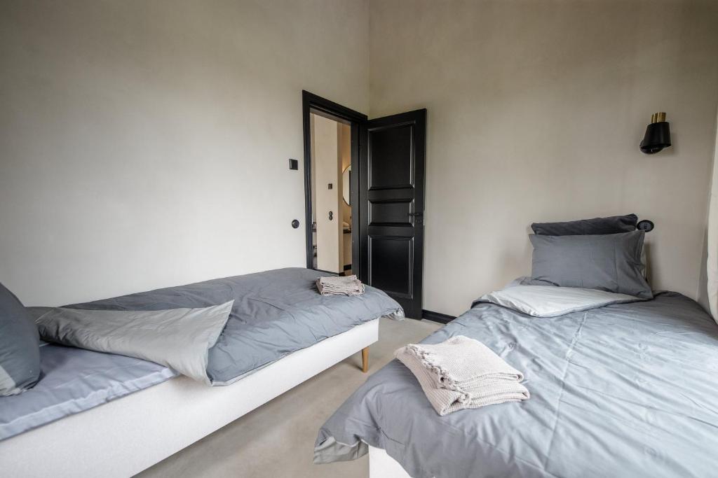 Postel nebo postele na pokoji v ubytování Ilmaveere Butiikhotell ja Restoran