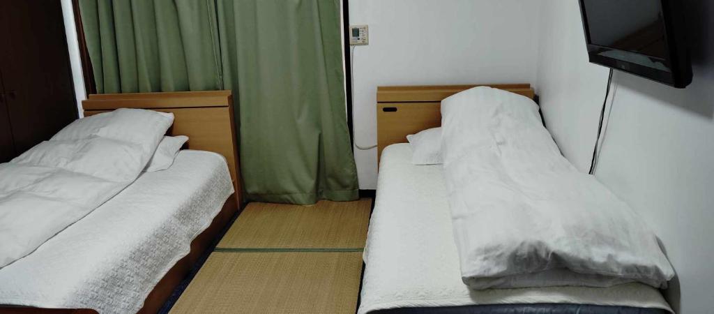 Postel nebo postele na pokoji v ubytování Oyama Guesthouse Kyoto