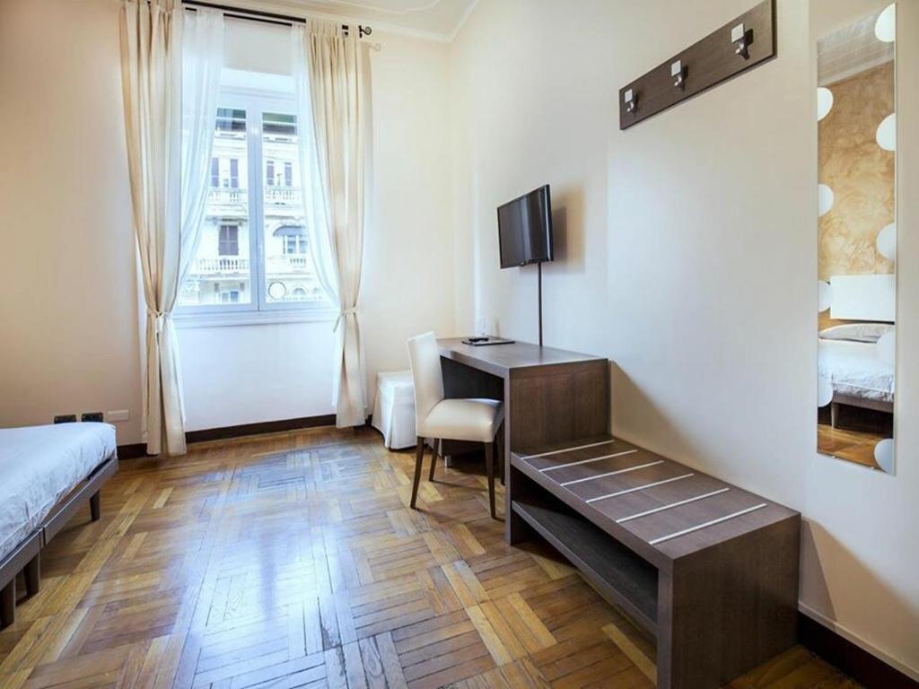 TV a/nebo společenská místnost v ubytování Guesthouse Vittoria Rooms - the Original since 2015