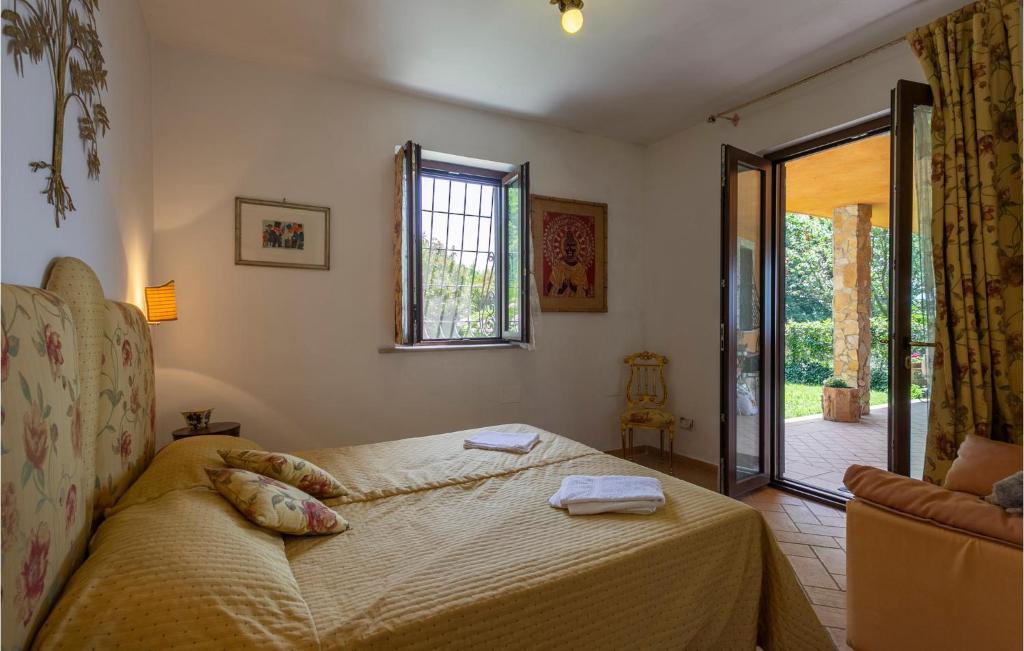 A bed or beds in a room at Nice Home In Bassano Romano With Wifi