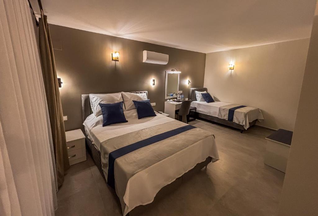 Postel nebo postele na pokoji v ubytování Aktaş Butik Hotel