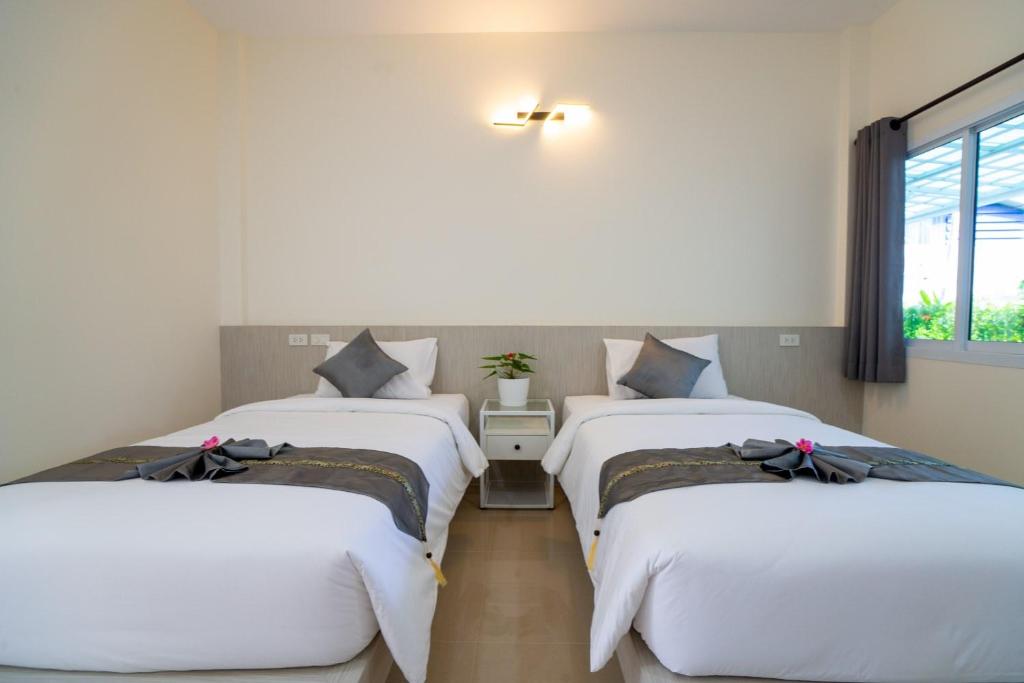 Postel nebo postele na pokoji v ubytování Puean Chang Resort Phuket