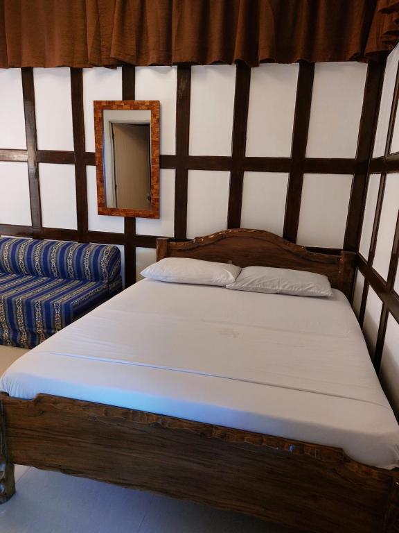 Postel nebo postele na pokoji v ubytování Yuken Mari Beach Resort Panglao