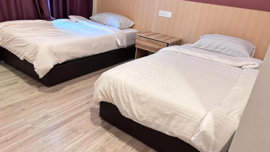 Postel nebo postele na pokoji v ubytování New YX oasis hotel 新悦喜雅居自助酒店