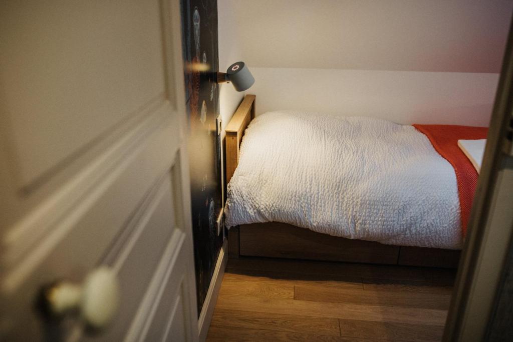 Postel nebo postele na pokoji v ubytování Le Mora Hôtes