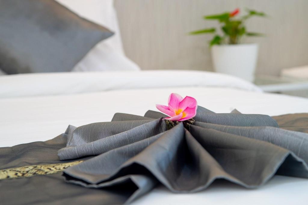 Postel nebo postele na pokoji v ubytování Puean Chang Resort Phuket
