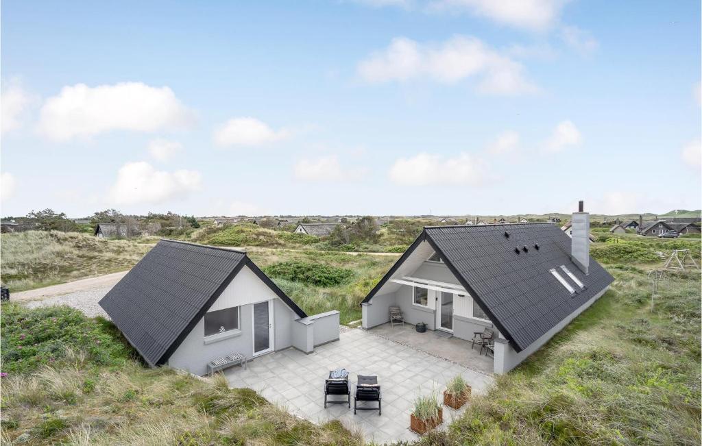 an aerial view of a house with a roof at Holiday Home Kræ Degns Vej Ringkøbing Iii in Klegod