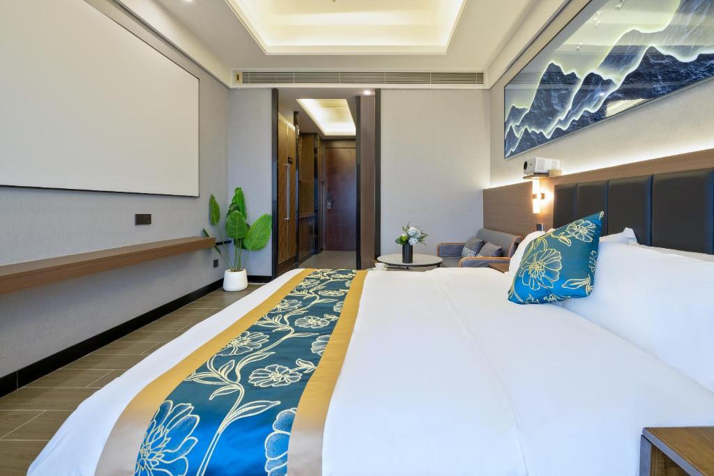 Postel nebo postele na pokoji v ubytování Xingyin Cloudy Hotel Guangzhou Changgang Subway Station - Free Shuttle Bus to Canton Fair Complex During Canton Fair Period