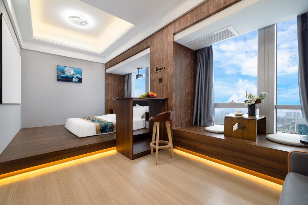 Postel nebo postele na pokoji v ubytování Xingyin Cloudy Hotel Guangzhou Changgang Subway Station - Free Shuttle Bus to Canton Fair Complex During Canton Fair Period