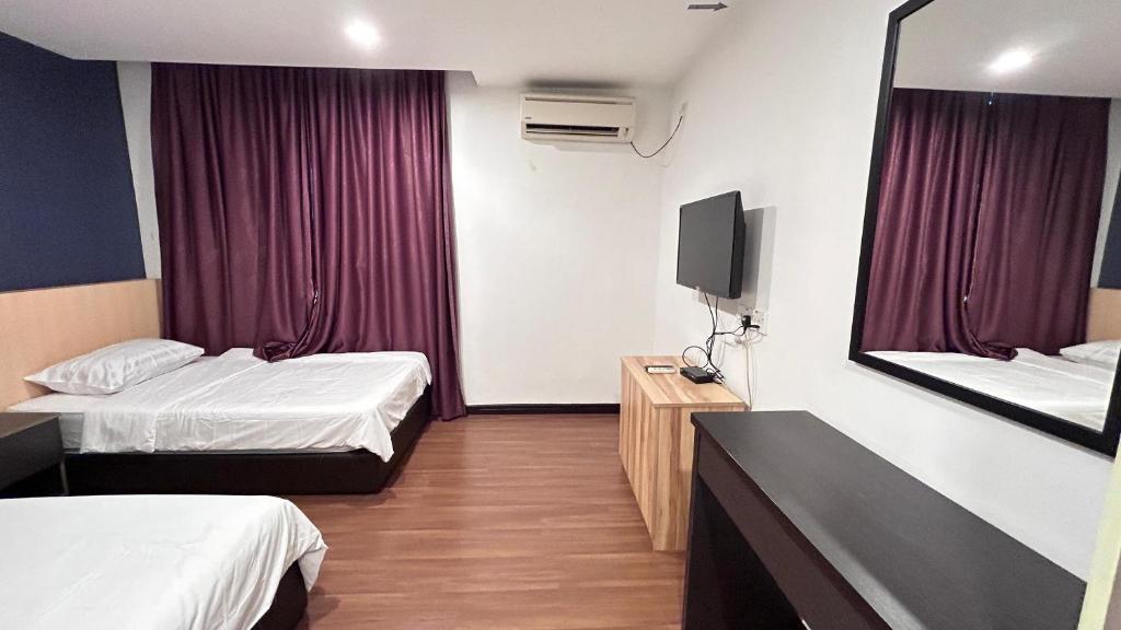 Postel nebo postele na pokoji v ubytování New YX oasis hotel 新悦喜雅居自助酒店