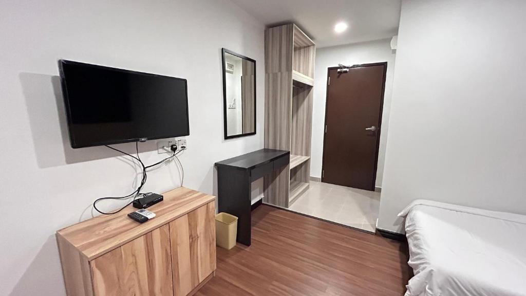 TV a/nebo společenská místnost v ubytování New YX oasis hotel 新悦喜雅居自助酒店
