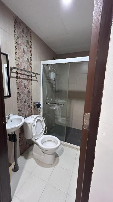 Koupelna v ubytování New YX oasis hotel 新悦喜雅居自助酒店