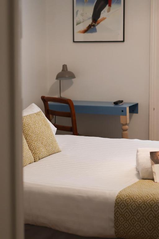 Postel nebo postele na pokoji v ubytování Hôtel du Simplon