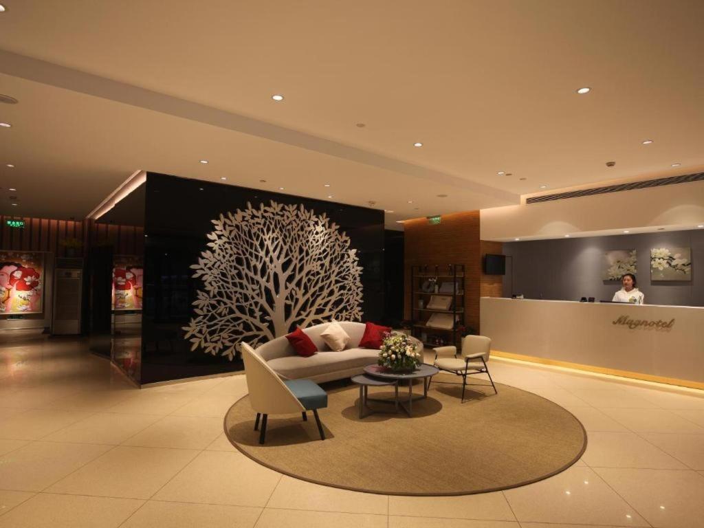 Posezení v ubytování Magnotel Business Xuzhou Jinying Sudi Road Metro Station