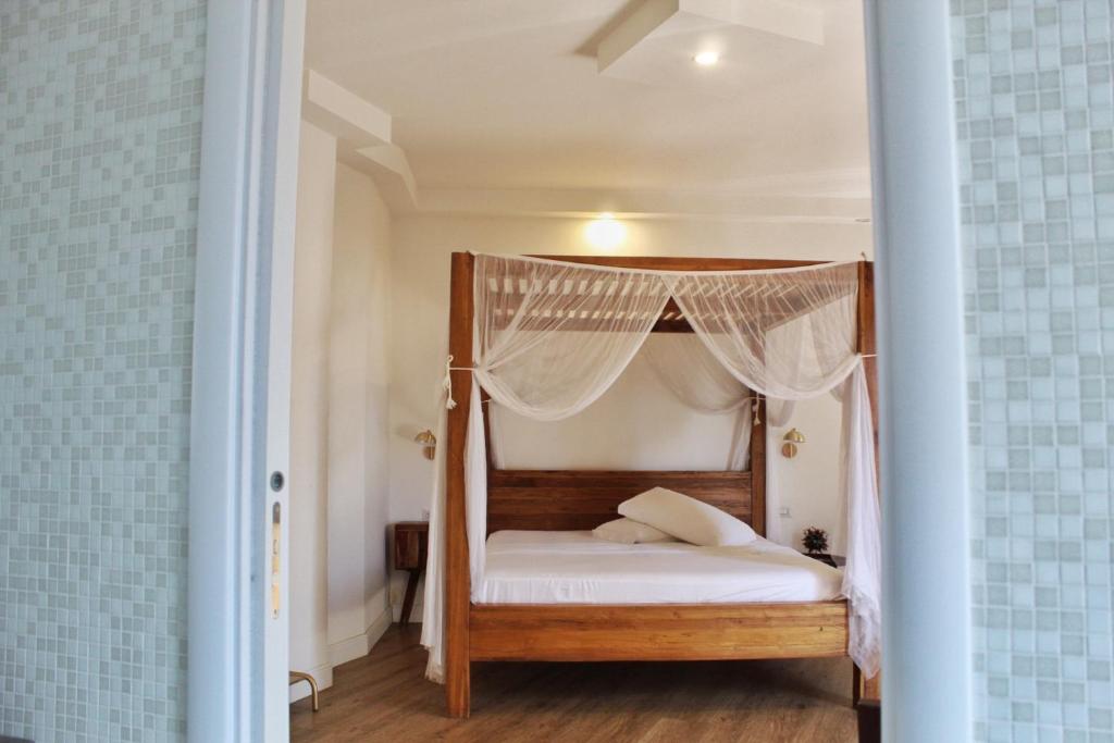 Postel nebo postele na pokoji v ubytování Domino Hotel