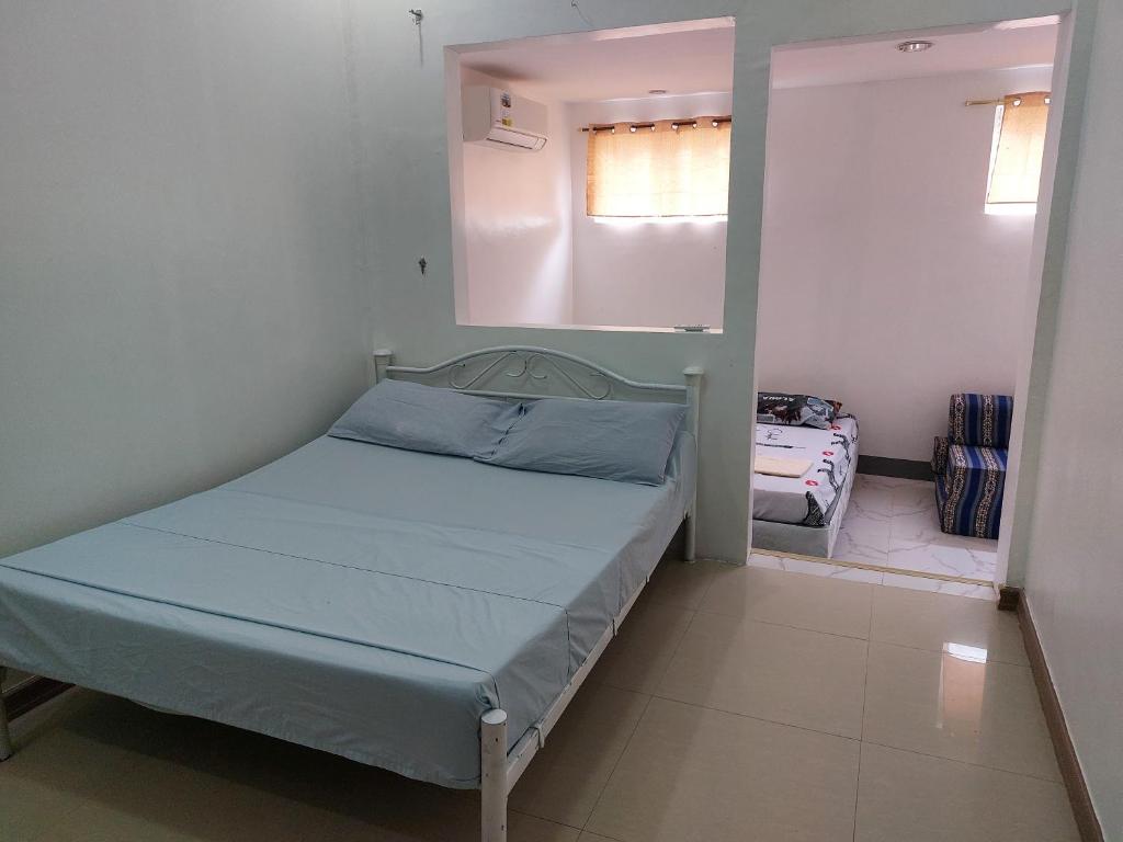Postel nebo postele na pokoji v ubytování Yuken Mari Beach Resort Panglao