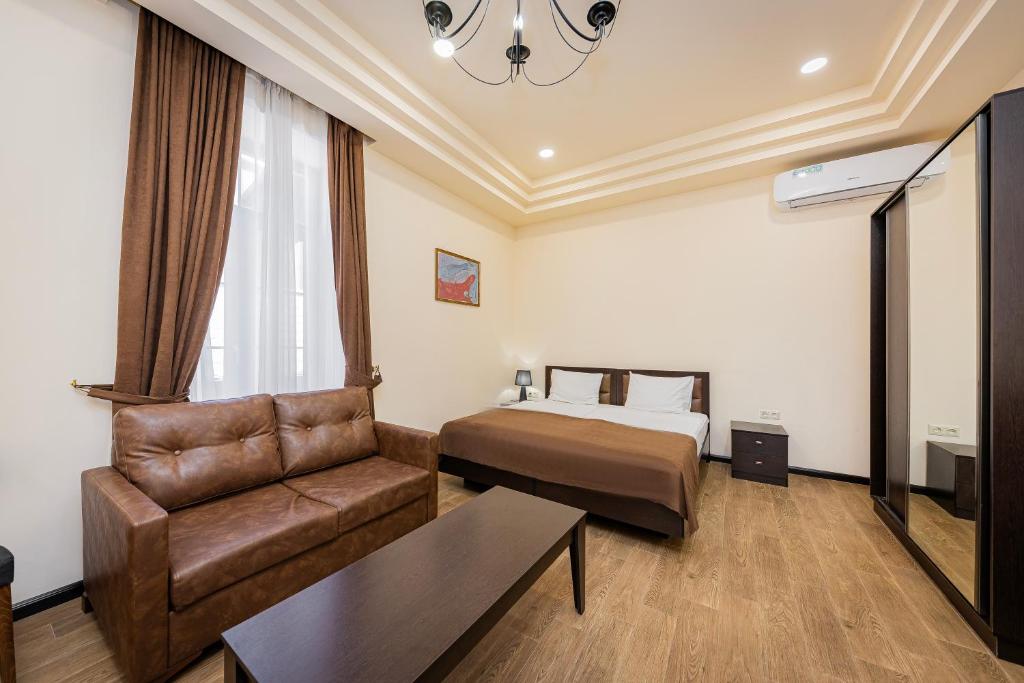 Postel nebo postele na pokoji v ubytování Boutique Living Hotel