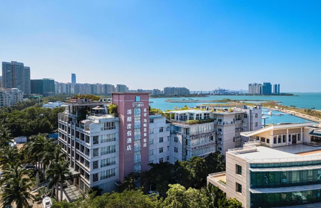 an aerial view of a city with buildings at HuangMa holiday yacht view sea resort hotel in Haikou