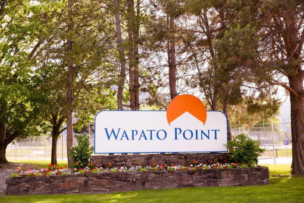 a sign for a wapato point in a park at Wapato Point Resort in Manson