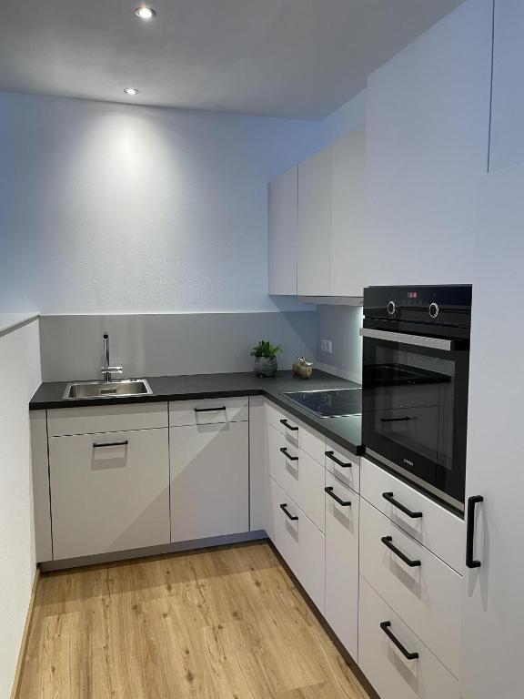 Kuchyň nebo kuchyňský kout v ubytování Appartement Mona