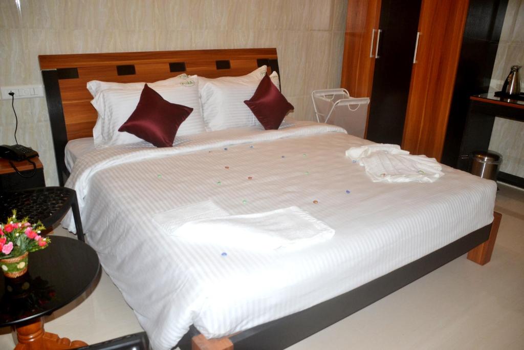 Postel nebo postele na pokoji v ubytování Peace Inn Chennai