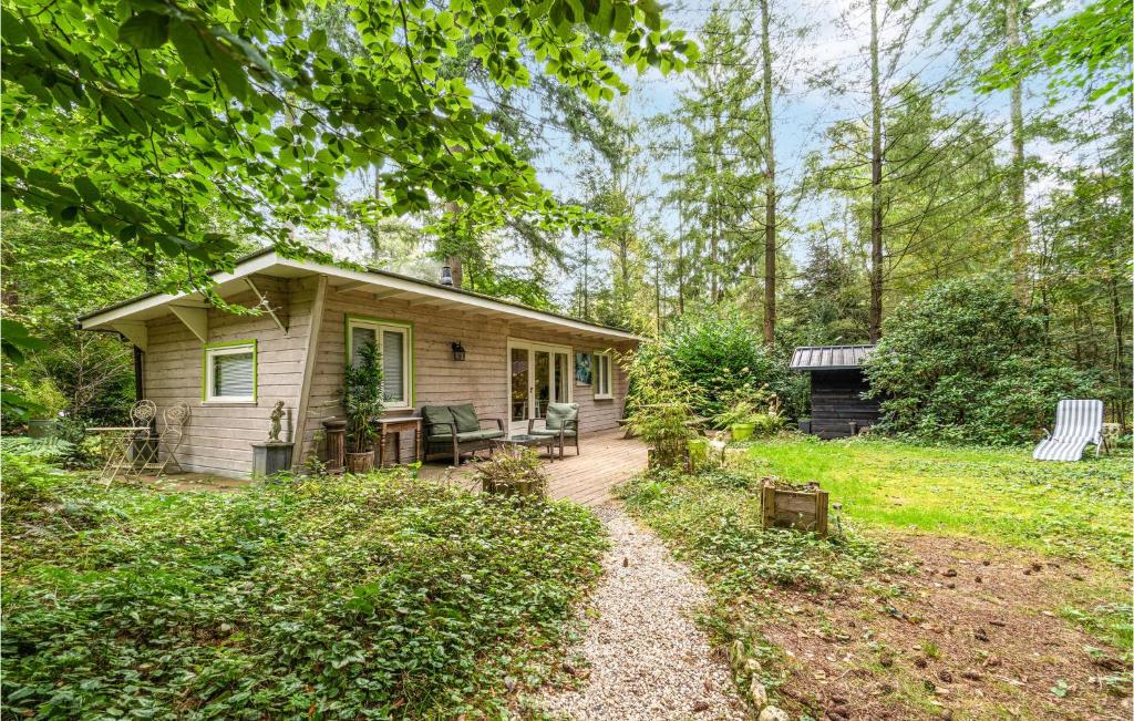 a small house in the middle of a yard at 1 Bedroom Stunning Home In Laag-Soeren in Laag-Soeren