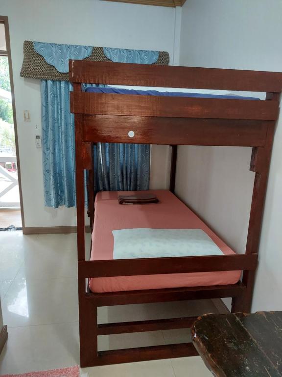 Postel nebo postele na pokoji v ubytování Yuken Mari Beach Resort Panglao