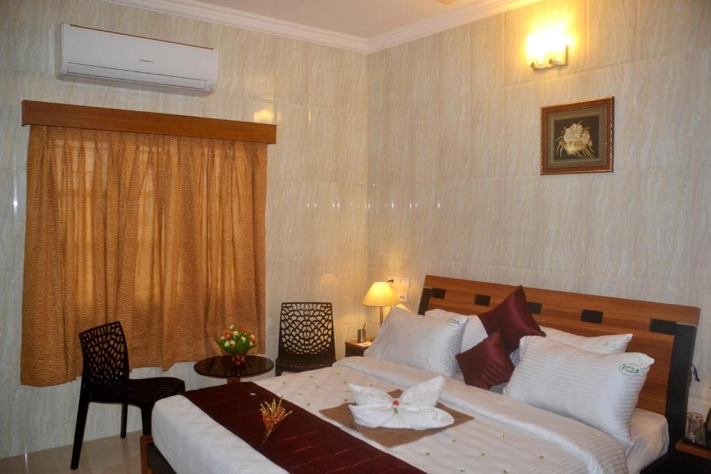 Postel nebo postele na pokoji v ubytování Peace Inn Chennai
