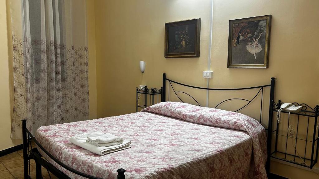 Postel nebo postele na pokoji v ubytování Albergo Fiorita