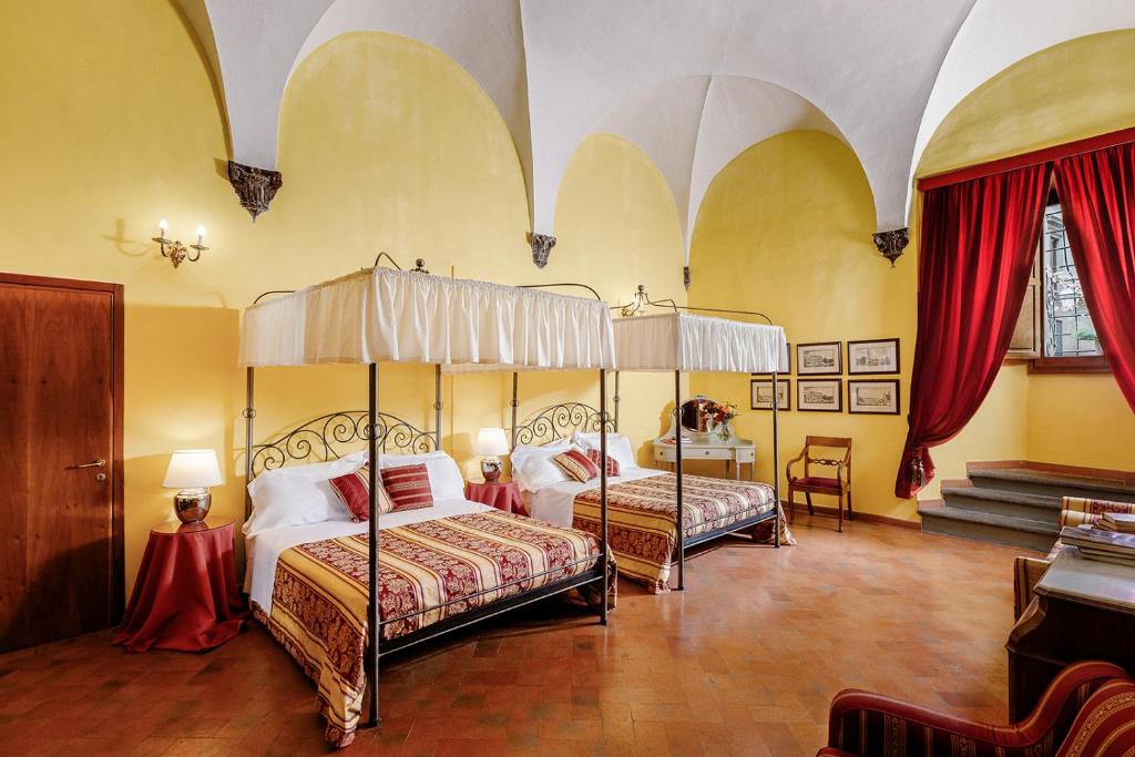 Postel nebo postele na pokoji v ubytování Hotel Palazzo dal Borgo