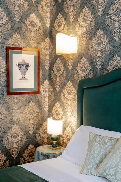 Postel nebo postele na pokoji v ubytování Hotel Palazzo dal Borgo